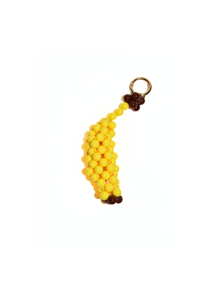 Banana-shaped keychain with yellow beads and brown stem on a white background
