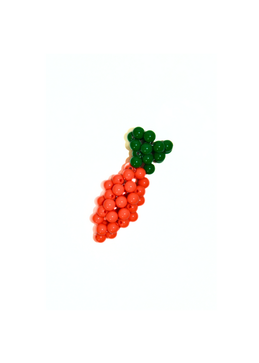Carrot-shaped object with green top on a white background
